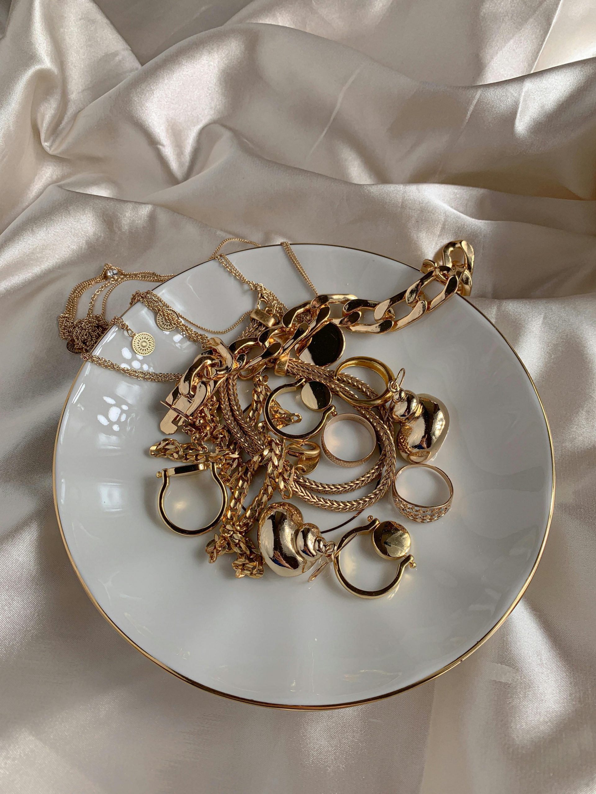 Unwanted gold jewellery items on a table