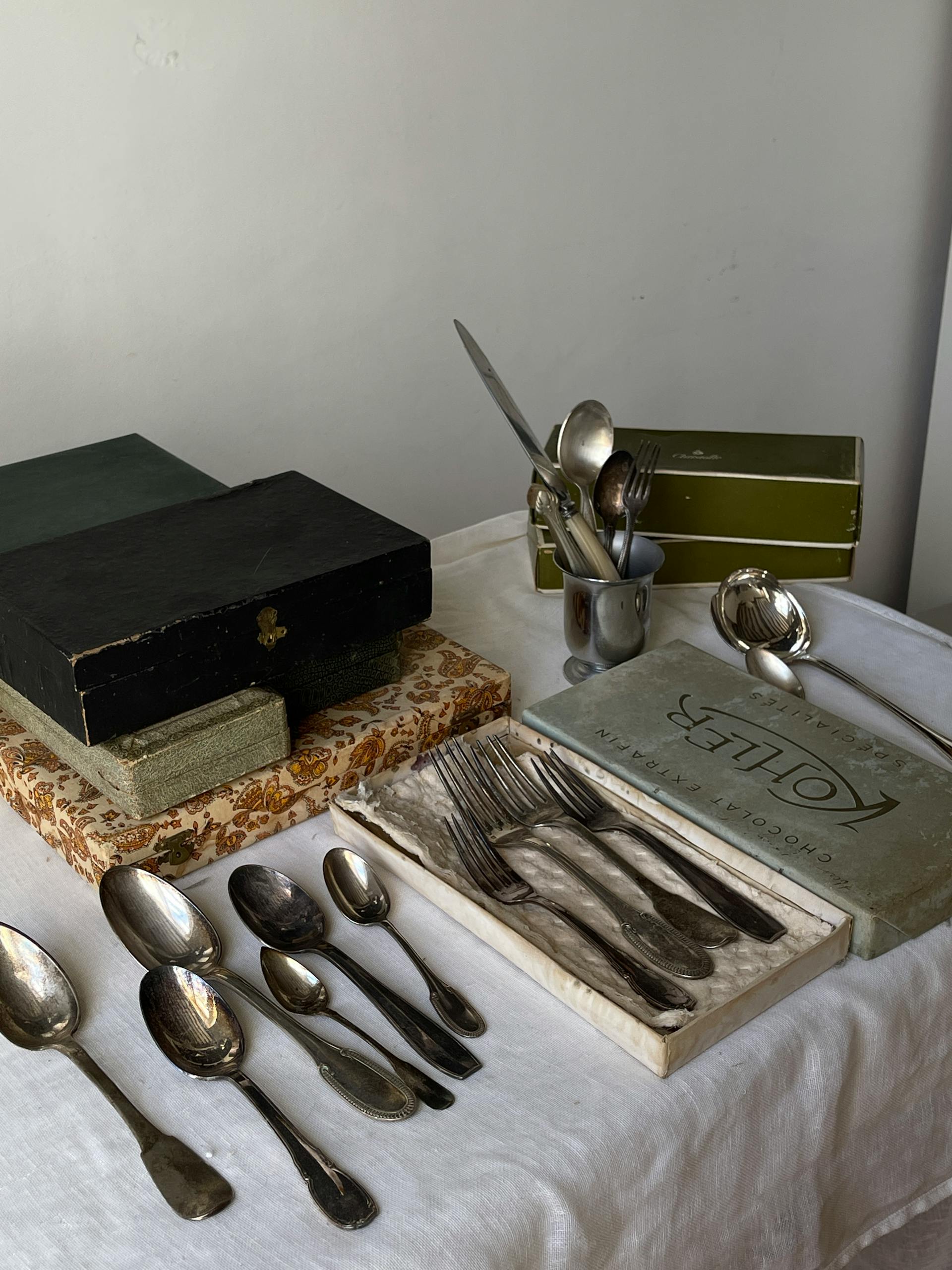 Silver cutlery set on a table