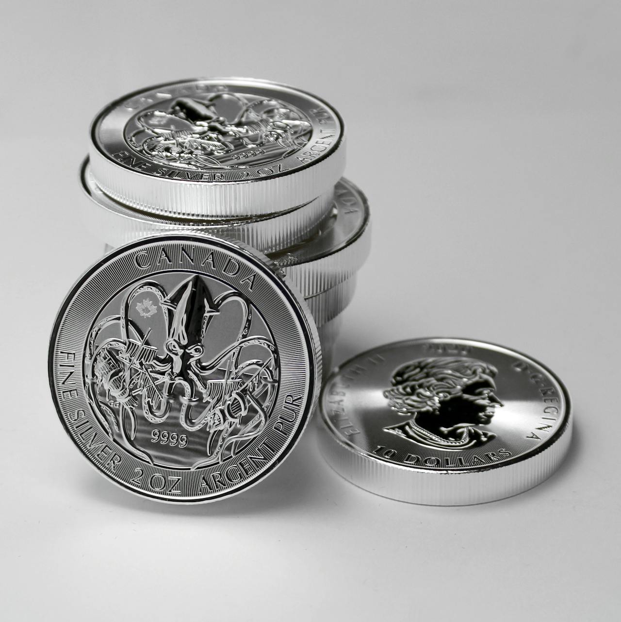 Shiny silver coins stacked up