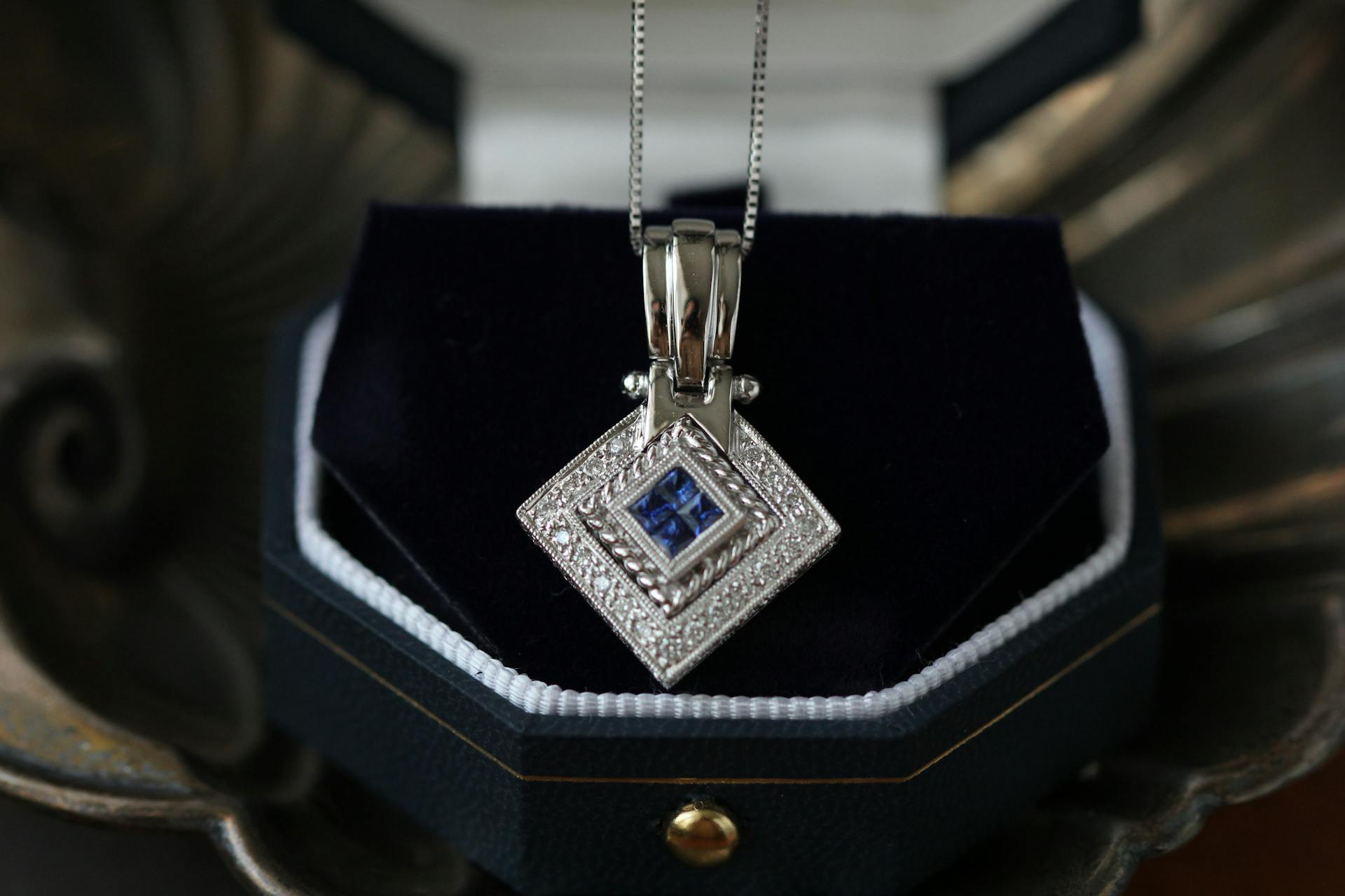silver pendant in a velvet box
